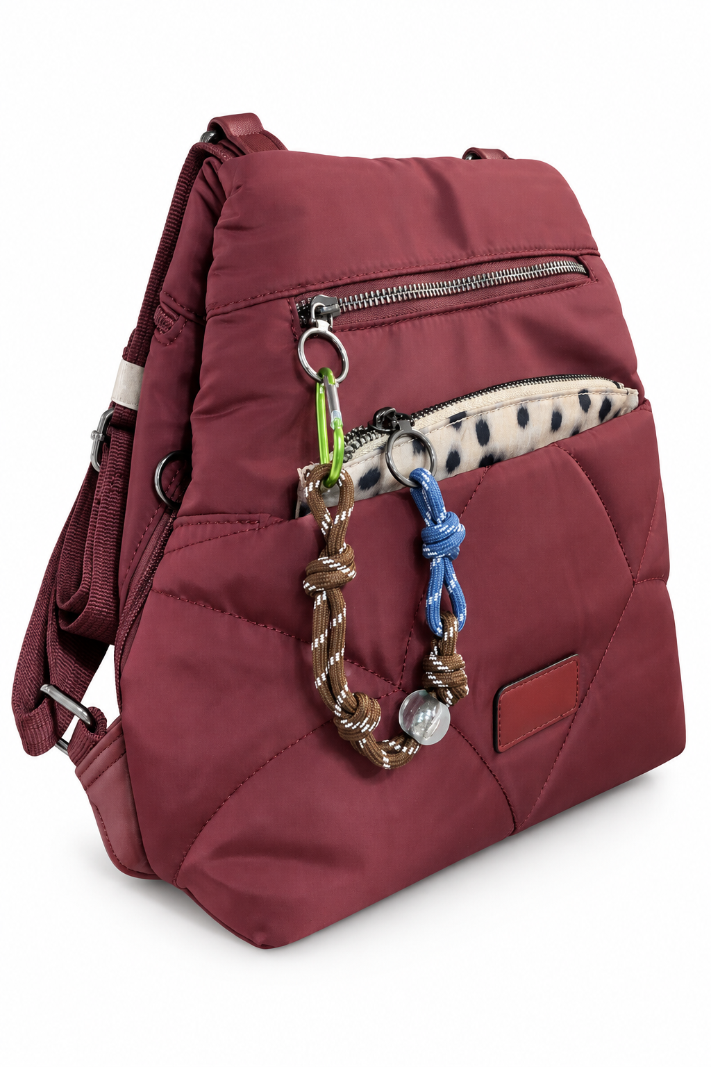 Mochila burdeos acolchada con bolsillos, cremalleras y detalles decorativos